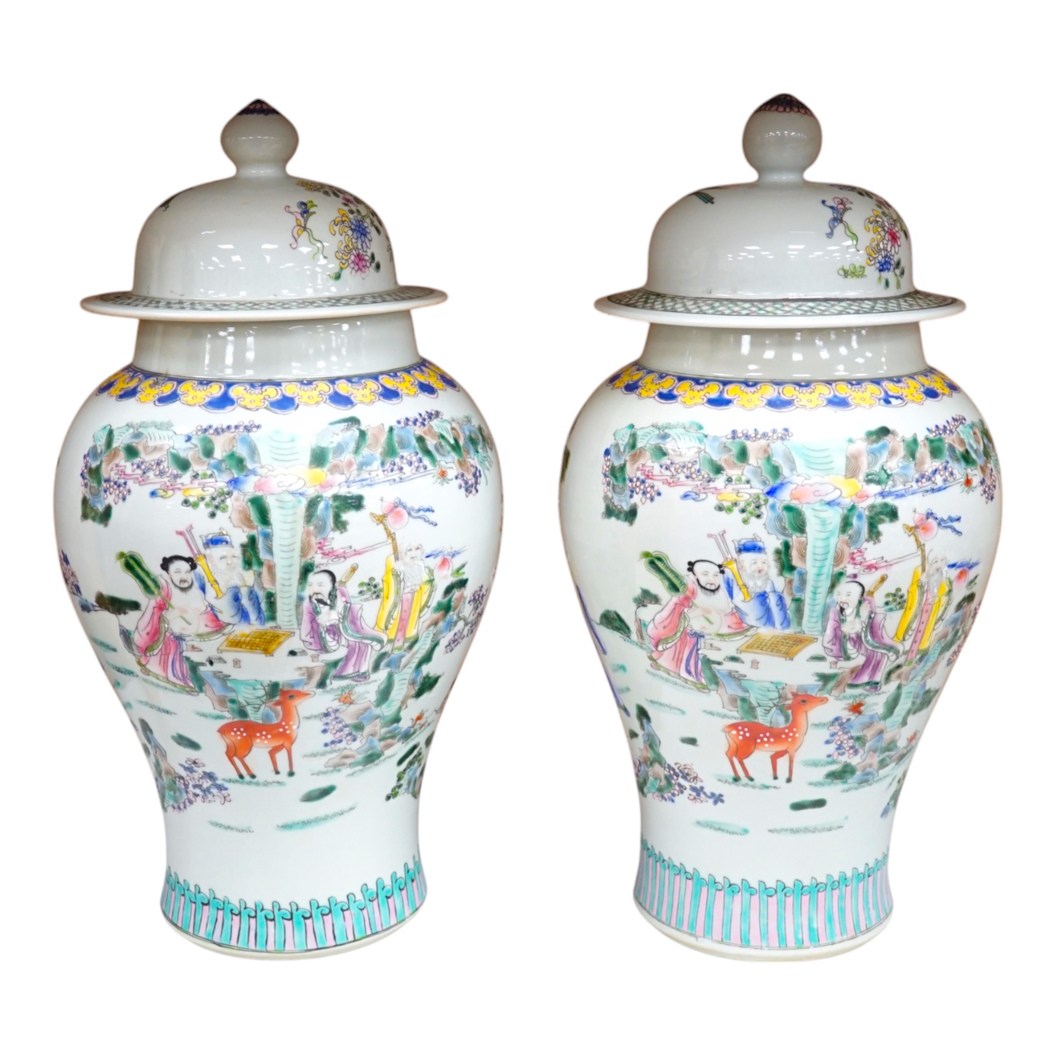 A pair of Chinese famille rose baluster vases and covers, 44cm high. Condition - good